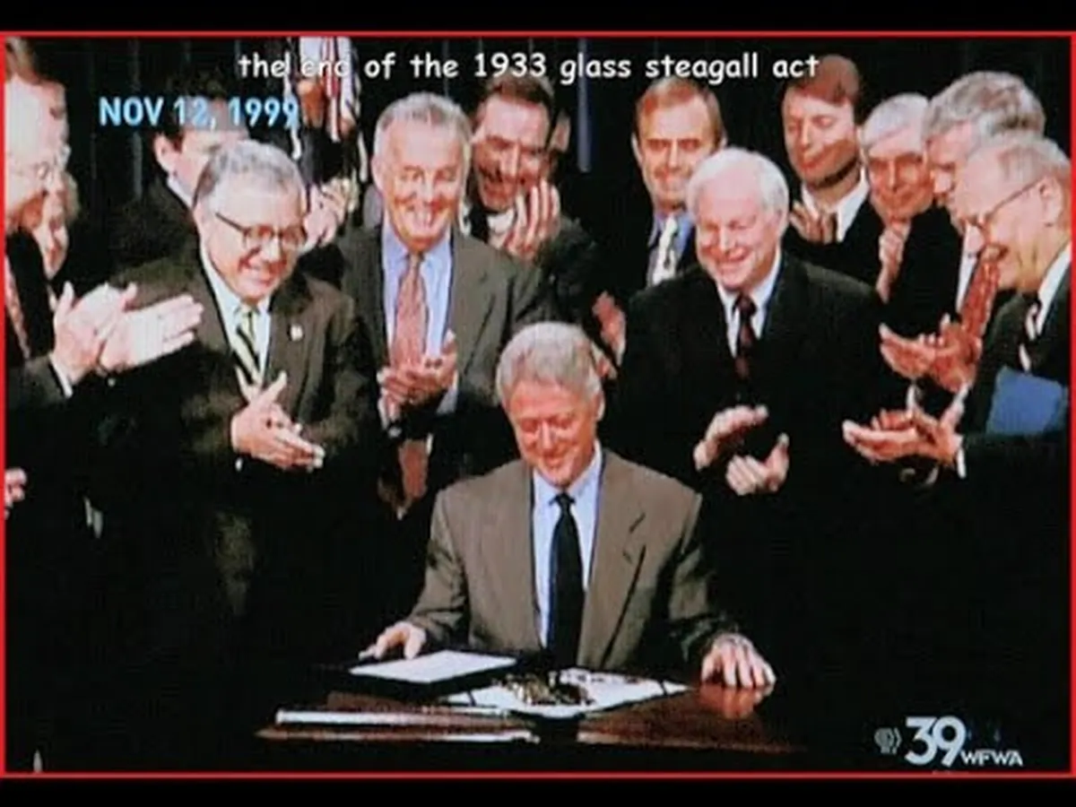 President Bill Clinton signing the repeal of the Glass-Steagall Act on November 12, 1999, surrounded by supporters