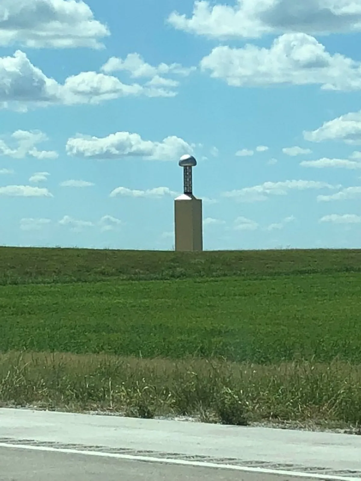 Photograph of a Zenneck wave tower by Visiv featuring its unique design and modern structure.