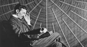 Nikola Tesla in his Lab - Pioneering Scientist Nikola Tesla sitting in a laboratory surrounded by electrical equipment