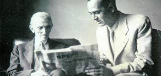 Nikola Tesla Historical Photo - Innovator and Inventor Historical photo of Nikola Tesla and a companion reading a newspaper