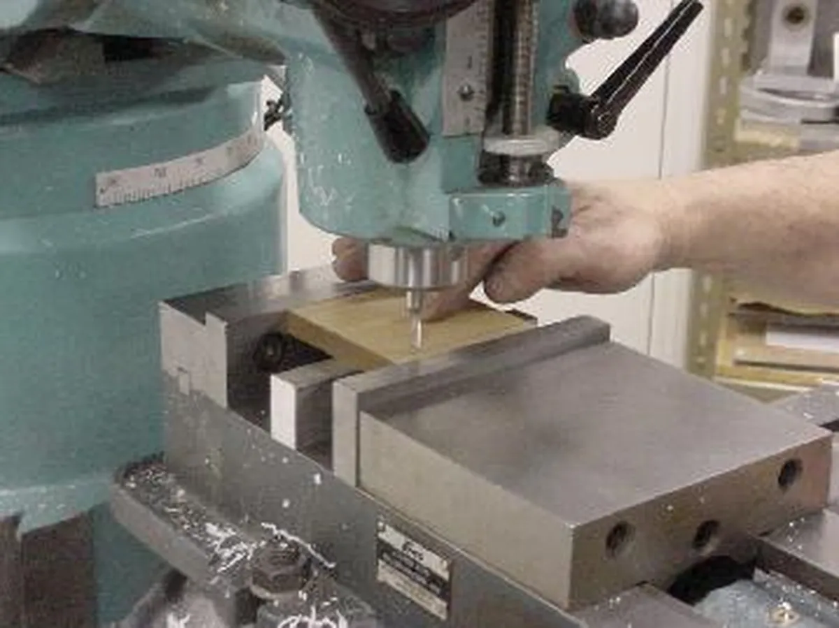 Close-up of a milling machine being used to create components for a Tesla coil