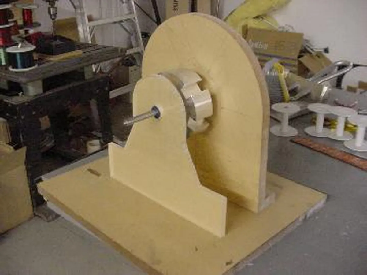 A wooden apparatus resembling a device attributed to Nikola Tesla, showcasing its unique design and construction