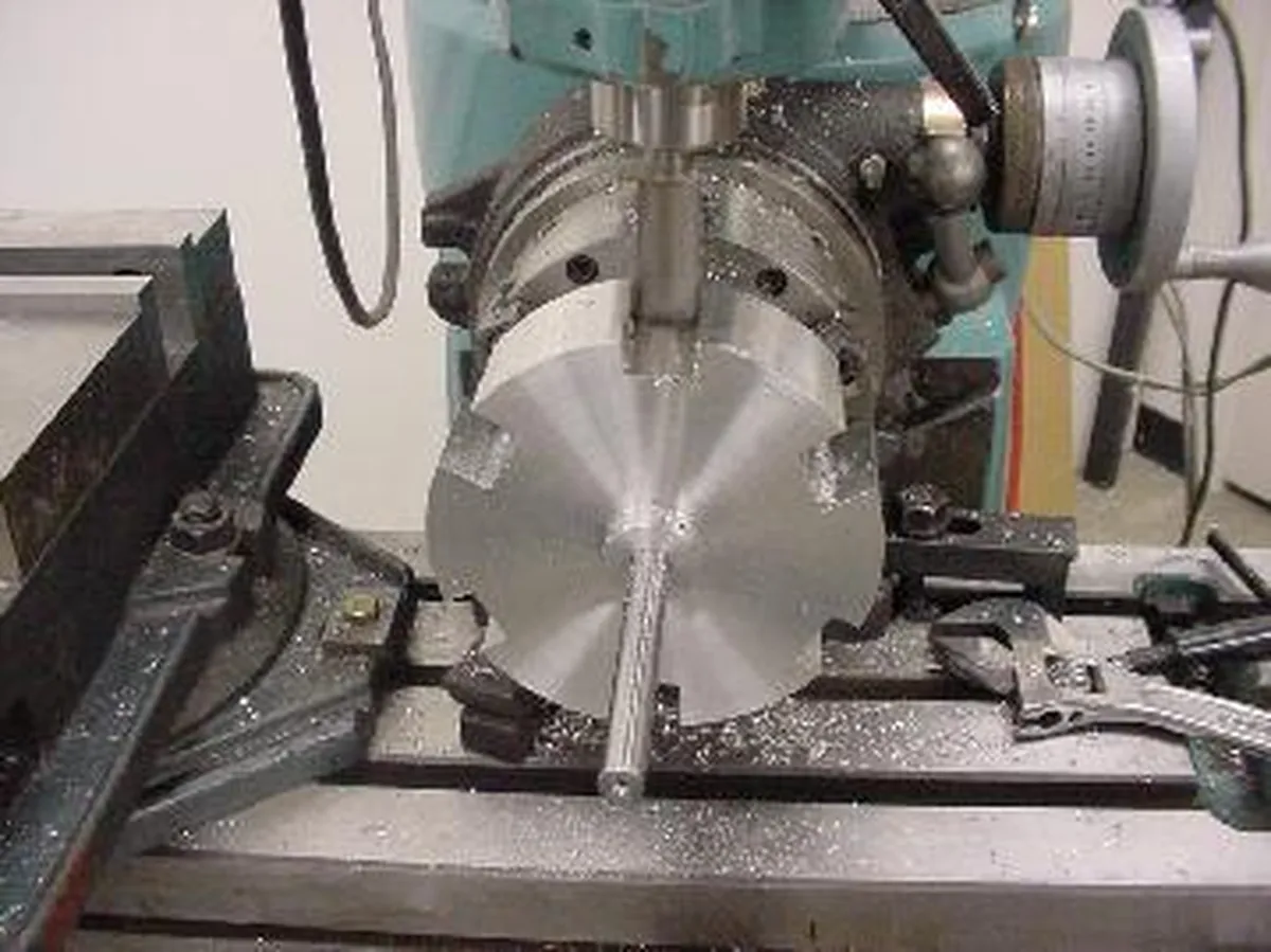 Precision machining of metal component on milling machine